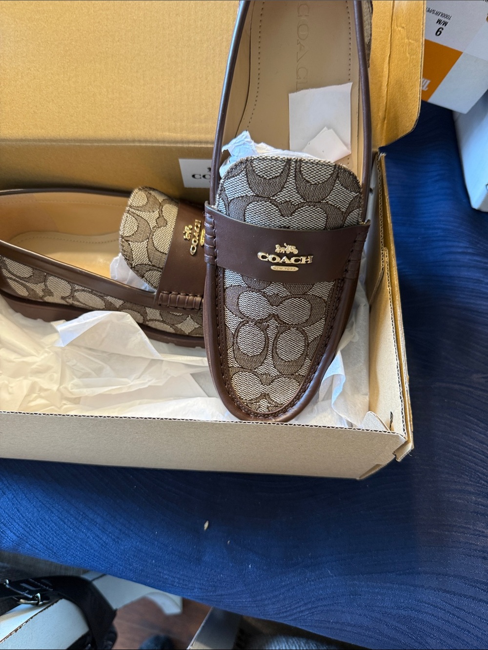 COACH women’s Brown Signature Canvas Penny Loafers with Dark Brown Leather Trim